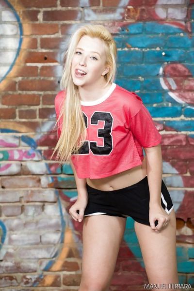 Teen pornstar Samantha Rone removing shorts to flash pink panties