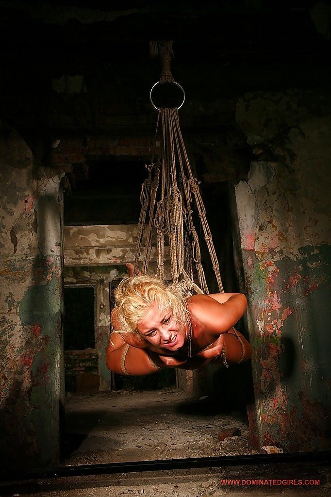 Blonde babe Angelic Diamond tied up tries to escape from BDSM sex