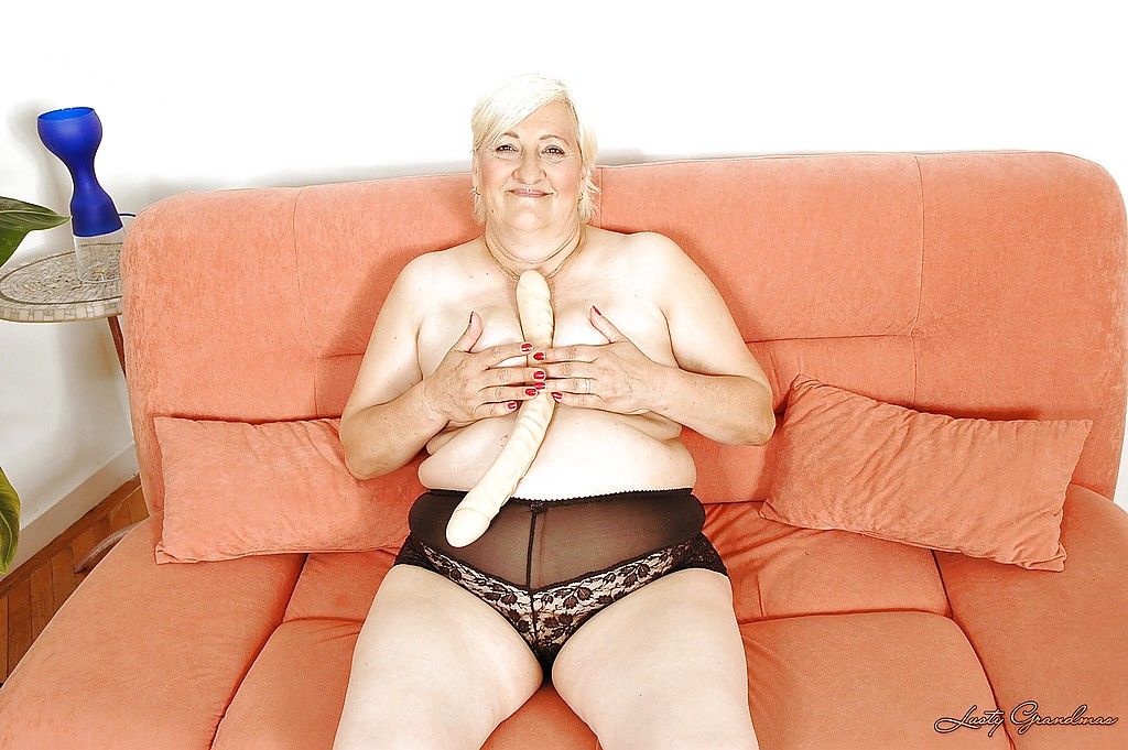 Fatty granny masturbating her hairy slit with a huge dildo
