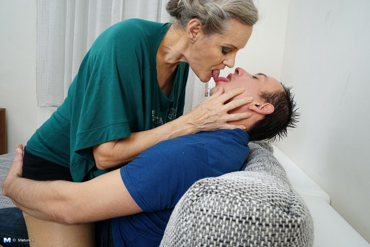 Grey haired granny and her young boy toy get down to fucking after foreplay