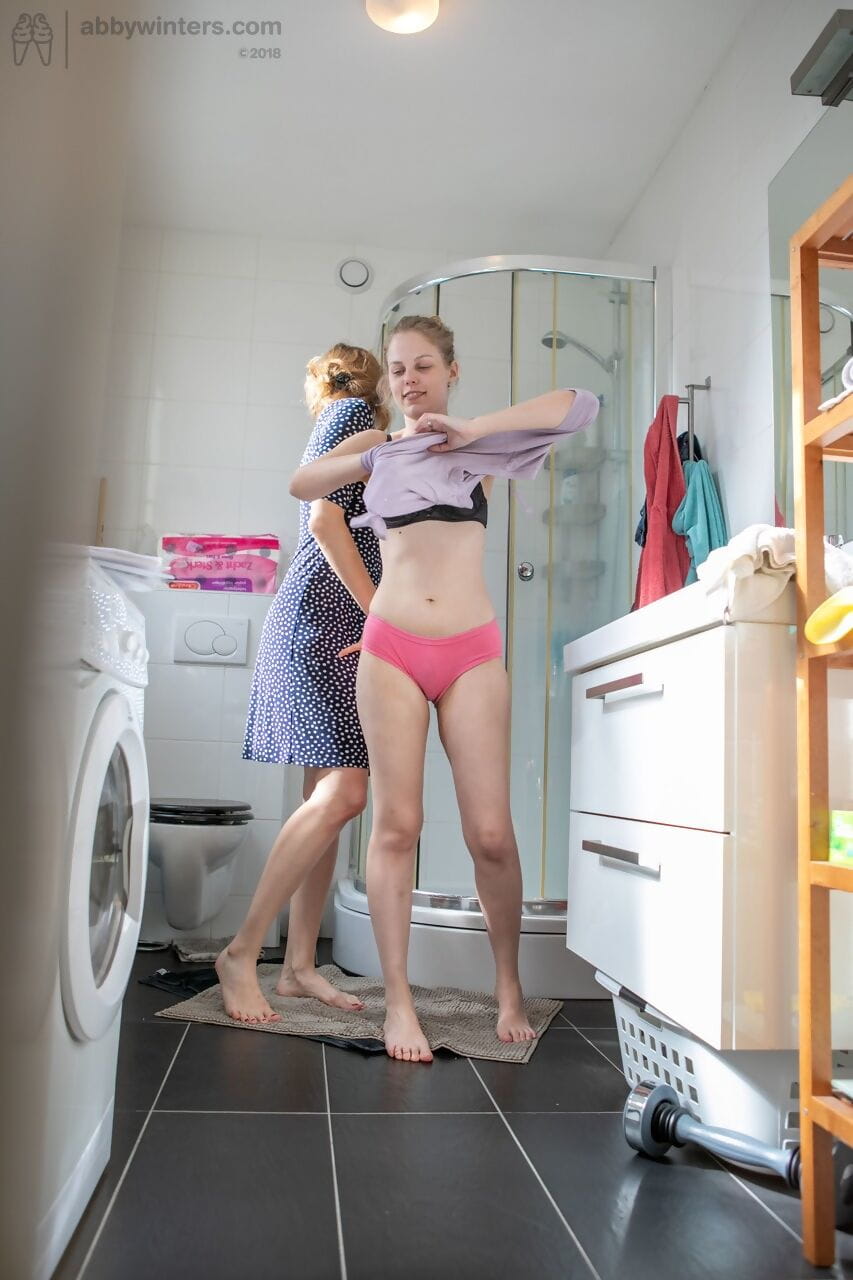 Lesbians Rose K- Layla K show natural tits while dressing in the laundry room