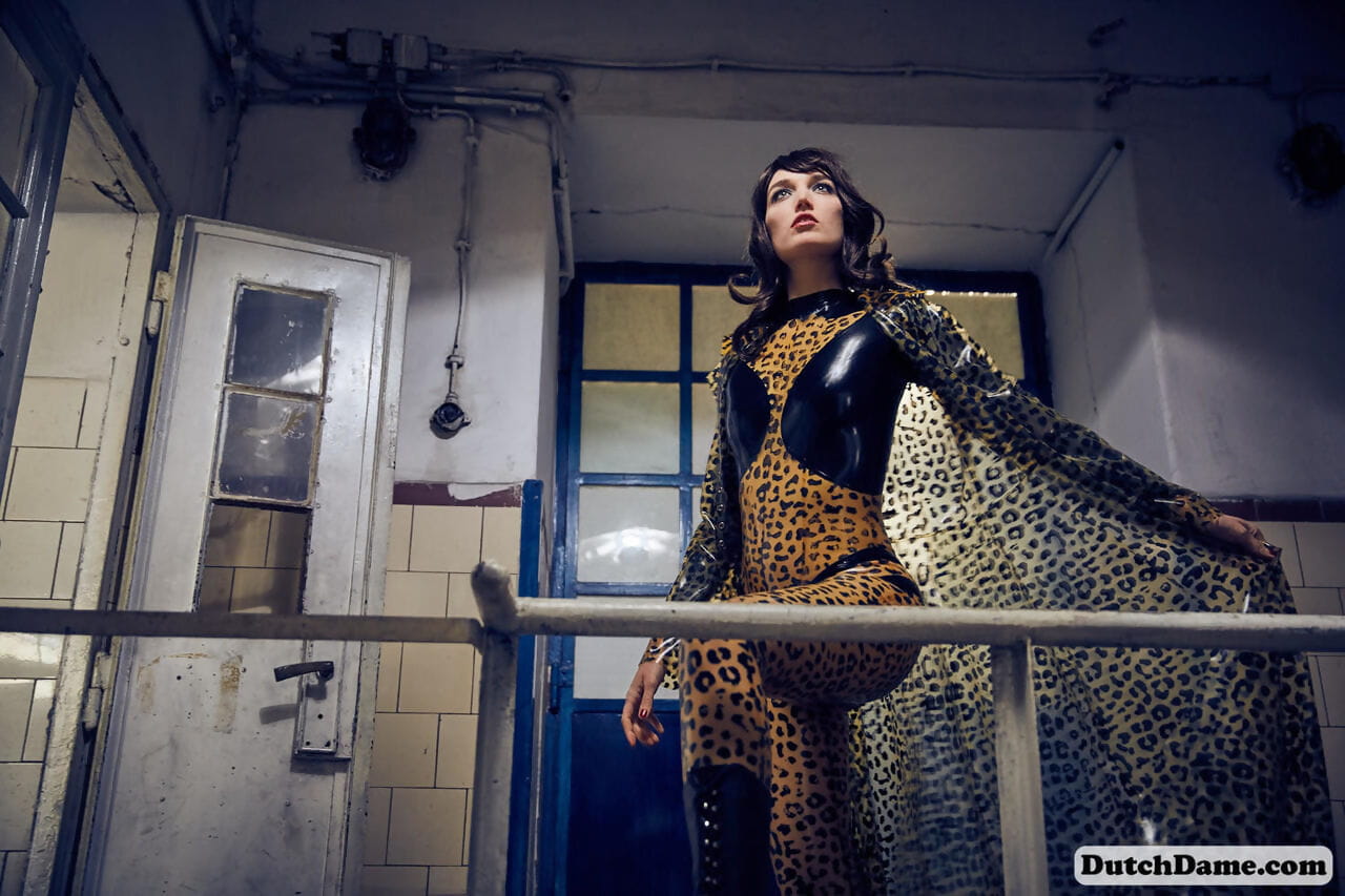 Solo model strikes hot poses in full body leopard print costume