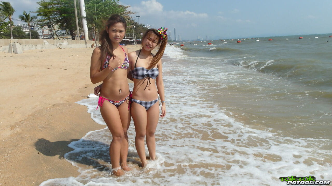 Delicious teenage Thai babes Bee and Miaw posing at the beach in hot bikinis