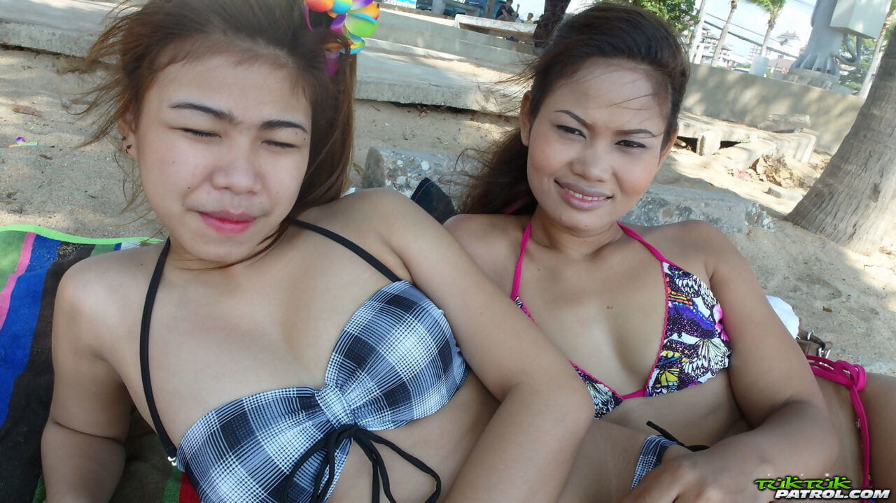 Delicious teenage Thai babes Bee and Miaw posing at the beach in hot bikinis