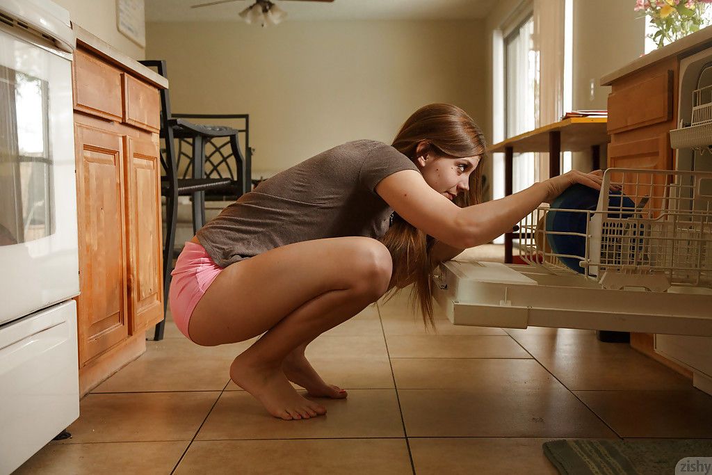 Charming brunette teen Aubrey Snow bending over on the kitchen floor