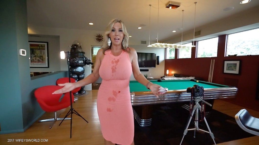 Clothed blonde housewife Sandra Otterson modeling on balcony and pool table