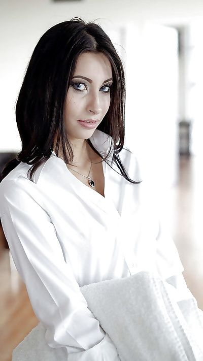Brunette babe Jade Jantzen posing fully clothed in white blouse and skirt